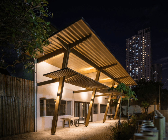 A home designed around existing trees, showcasing biophilic architecture.