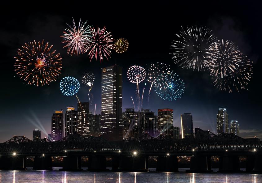 fighting light polution article on vibrant fireworks display illuminating the night sky above skyscrapers.