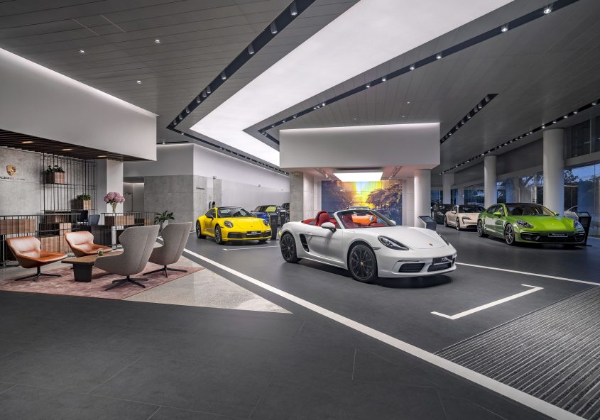 the new Destination Porsche dealership with strategically placed lighting to highlight vehicles.