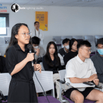 A young student standing out and speaking out her thoughts