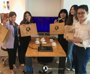 Committee members and interior design students meet together at kobi's office